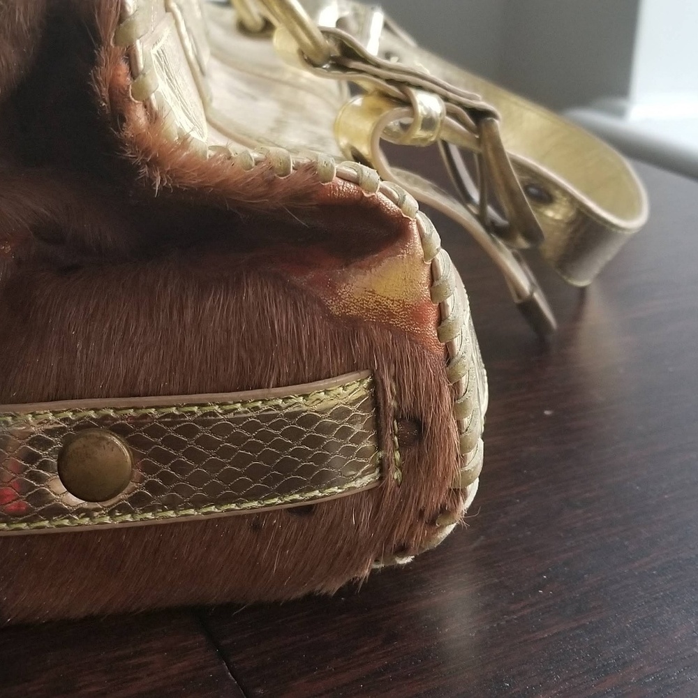 Loop Gold leather and pony fur handbag.